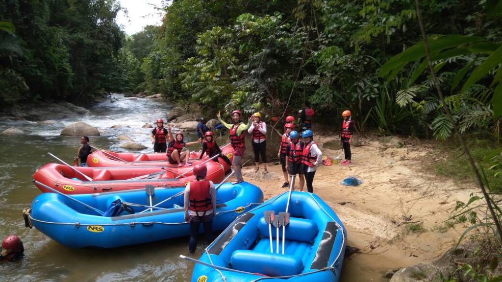 Group enjoying white water rafting in Kuala Kubu Bharu near Kuala Lumpur